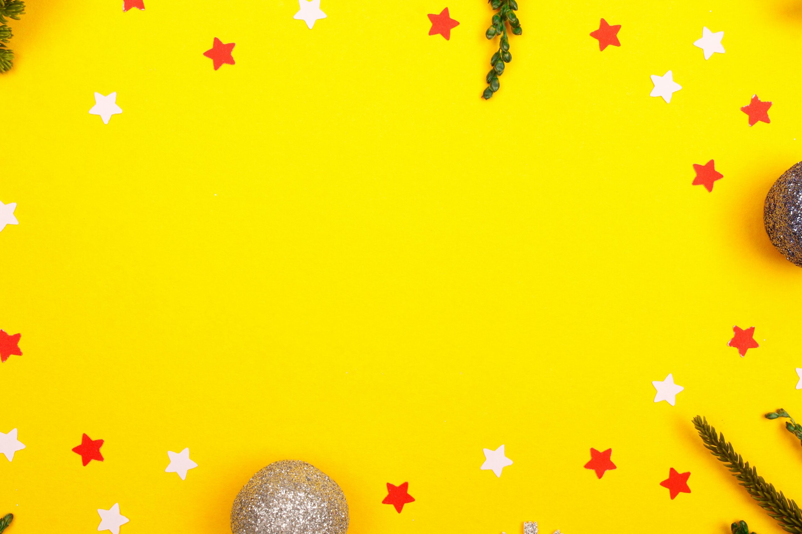 Bright yellow festive background with Christmas decorations, stars, and greenery.