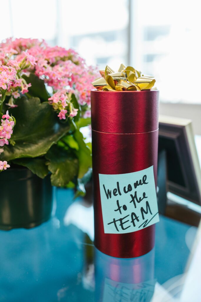 Welcome gift with note on office desk, ideal for new team members.
